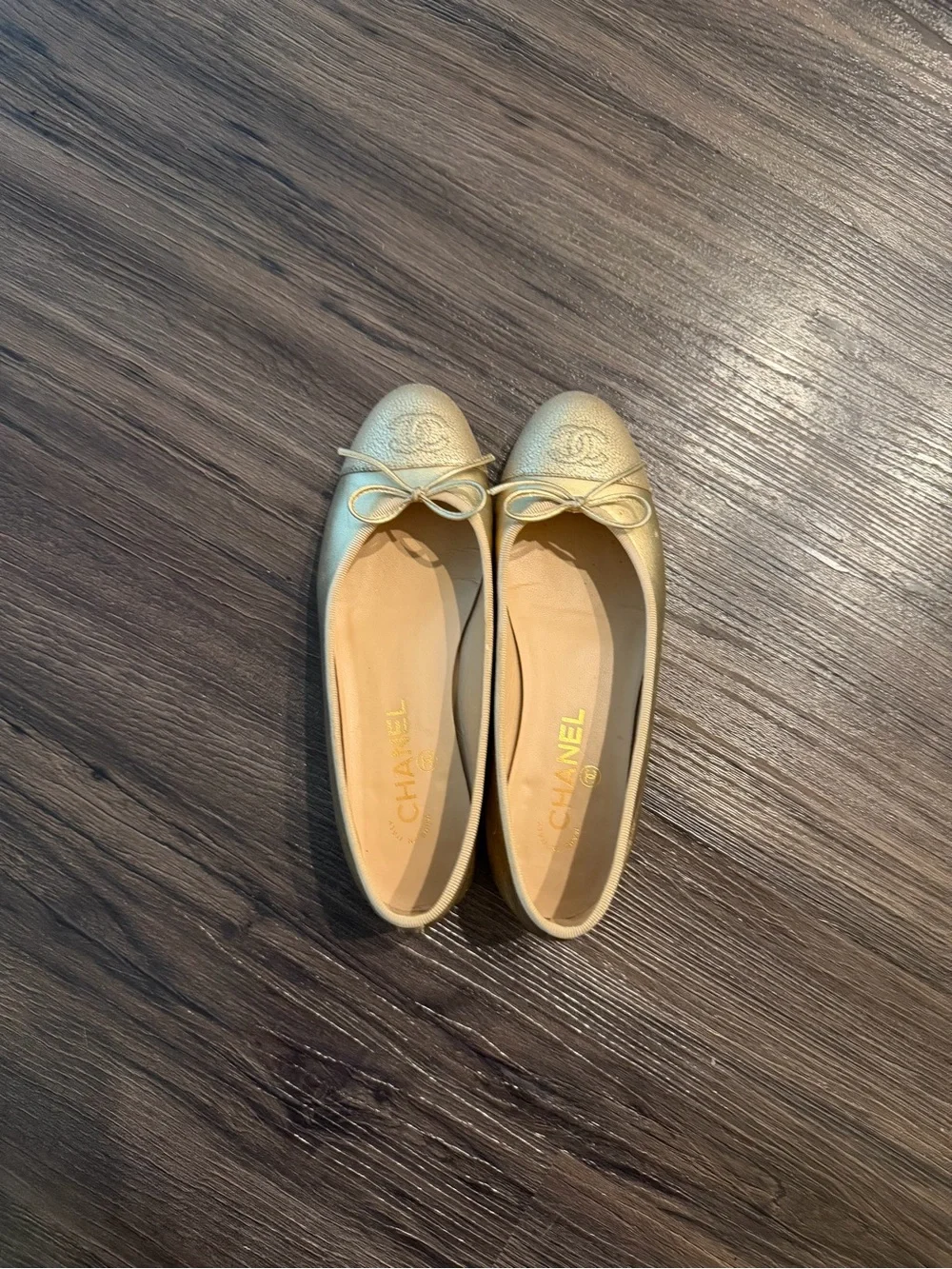 CHANEL Metallic Gold Leather Ballet Flats with Bow Accent
